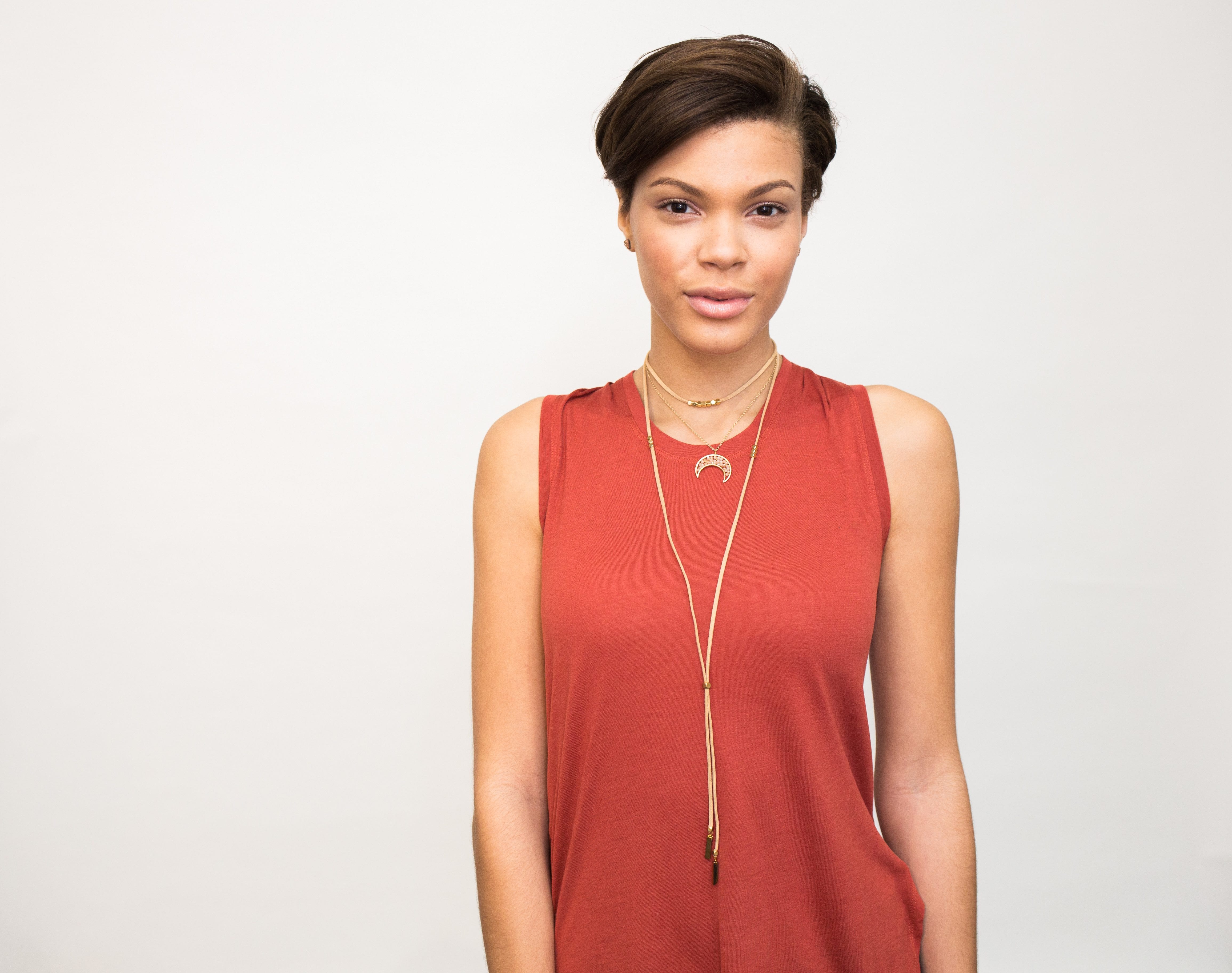 suede layered choker necklace on model with orange tank shirt
