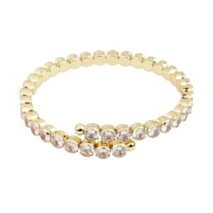 Gold-tone coil bracelet with rounded details and clear crystal accents across the front