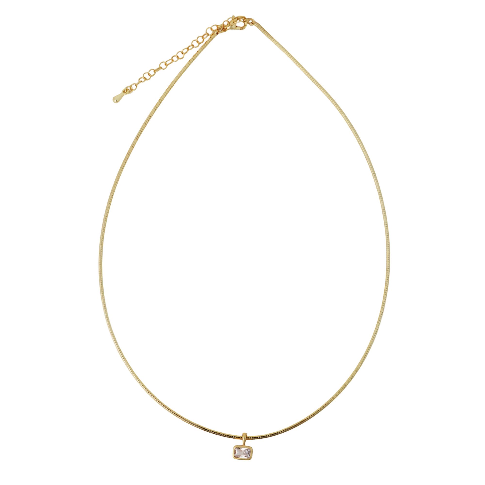 Slim gold-tone collar necklace with a petite clear crystal accent and extender chain